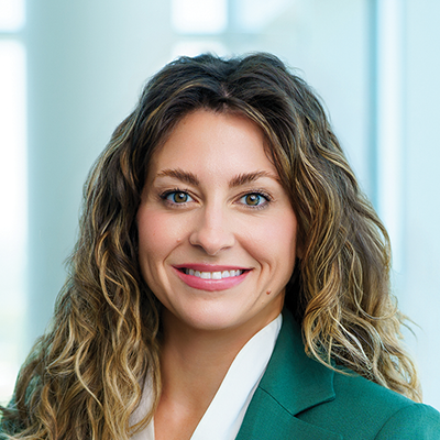 Headshot of Erin Branstrom smiling at the camera.