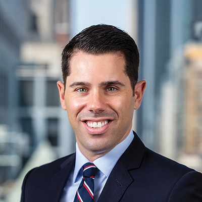 Headshot of Greg Eudicone smiling at the camera.