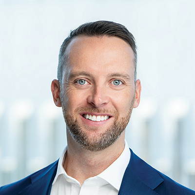 Headshot of Rob Fairfax smiling at the camera.