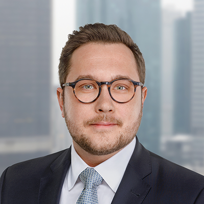 Headshot of Florian Hergert smiling at the camera.