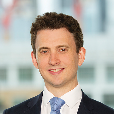 Headshot of Richard Holroyd smiling at the camera.