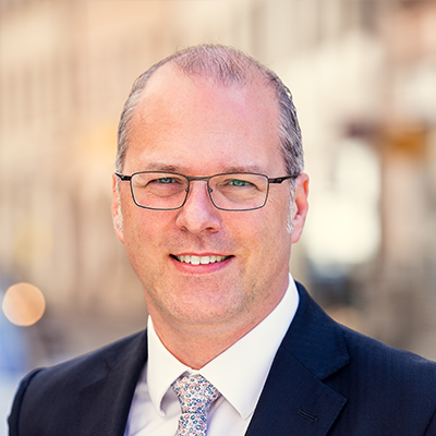 Headshot of Daniel Koehler smiling at the camera.