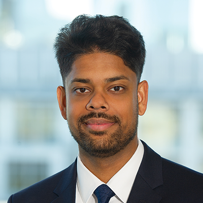 Headshot of Nissant Naganathi smiling at the camera.