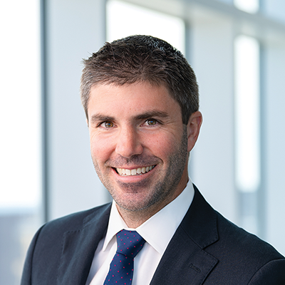 Headshot of Michael Searles smiling at the camera.