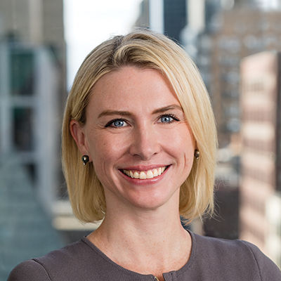 Headshot of Maggie Taplett smiling at the camera.
