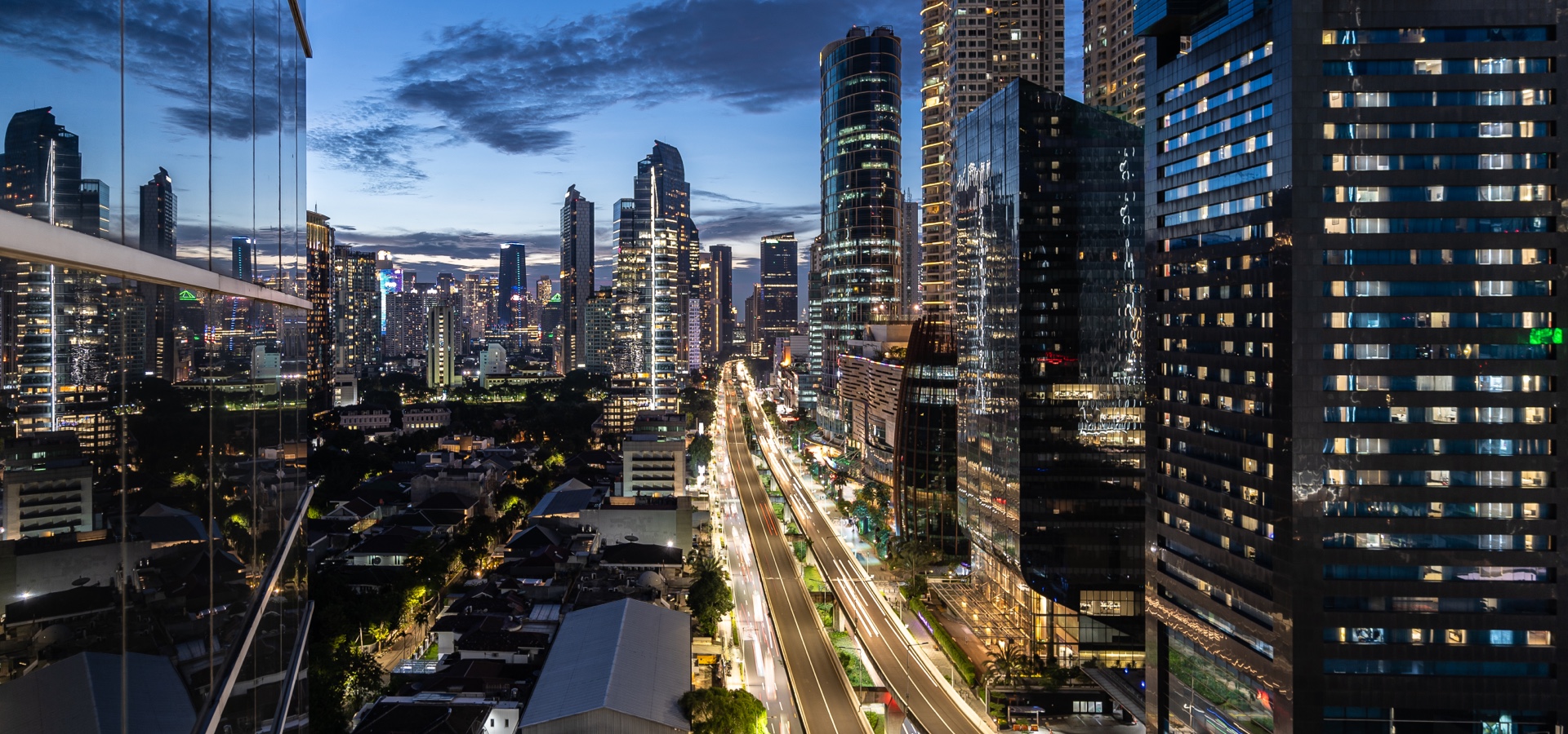 A busy business district in Jakarta, Indonesia at twilight.