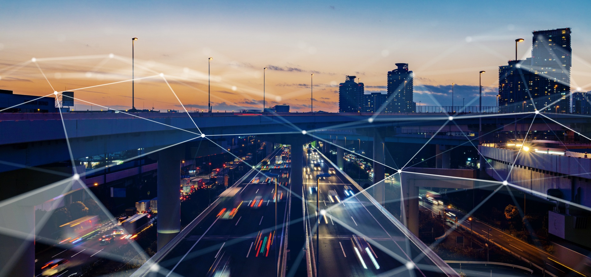 Cityscape overlayed with abstract digital connectivity lines.
