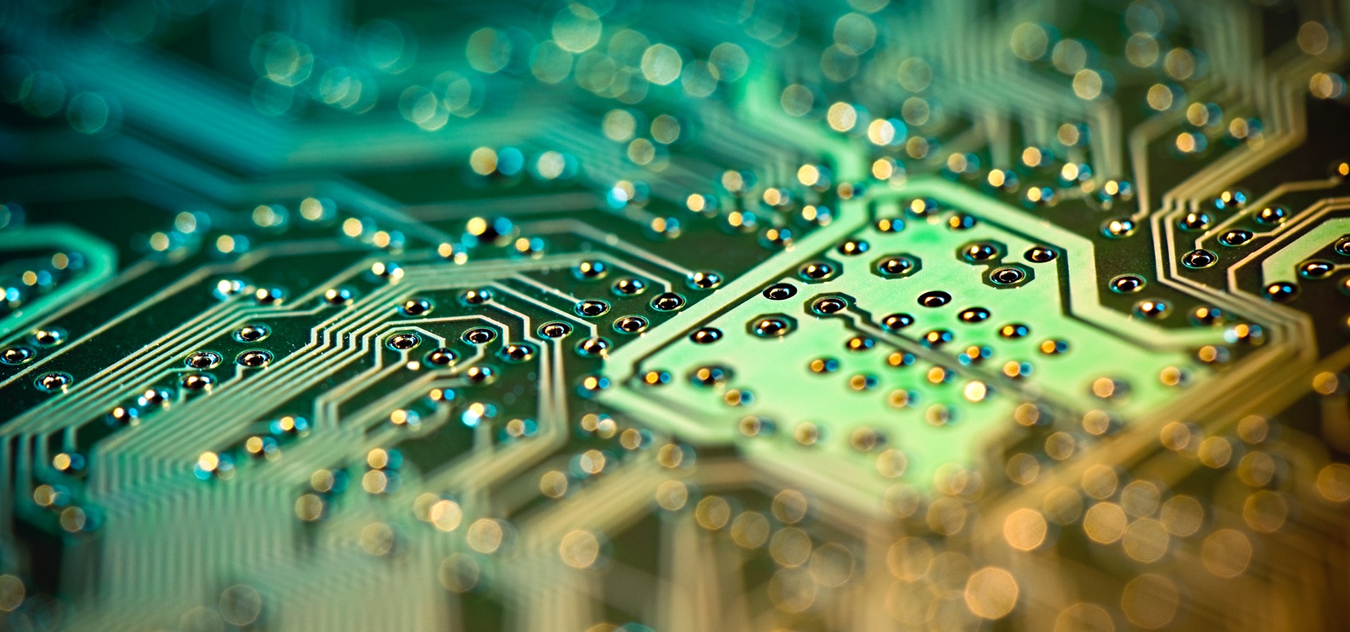 Abstract computer chip with green and yellow color accents.
